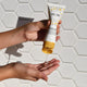 hands-with-cleanser-on-fingers-on-white-tile